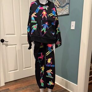 QUEEN OF SPARKLES Black Pants with Colorful Skier Design